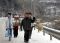重庆
<br>1月26日,重庆市酉阳县的村民在覆盖着积雪的公路上行走。连日来,重庆部分地区降雪,不少道路封闭,一些村民只能步行回家。