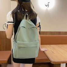 批發休閑大容量雙肩包包韓版時尚大學生書包女簡約純色旅行背包男