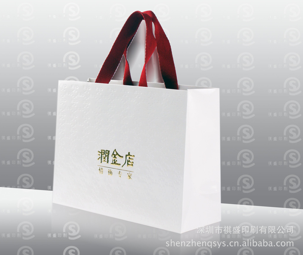供应外贸出口品牌冰白服装纸袋环保卡纸手提纸袋购物纸袋