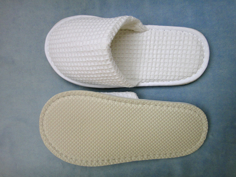 名称:酒店房间拖鞋 单位:双 规格:25*10cm 材质:华夫格面料 eva鞋底